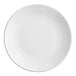 An Acopa matte white stoneware coupe plate with a white border.