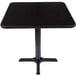 A black square Lancaster Table & Seating dining table with a metal base.