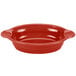 A red oval casserole dish with handles.