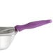 A Vollrath Jacob's Pride Spoodle with a purple handle.