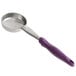 A close-up of a purple Vollrath Jacob's Pride round portion spoon with a hole in the handle.