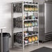 A Cambro Camshelving® Premium stationary rack with #10 cans in it.
