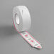 A roll of white tape with red labels that say "My Turn" and 3-digit numbers.