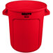 A red plastic Rubbermaid Brute trash can with black text.