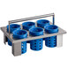 A metal rack with blue plastic containers with holes.