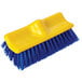A yellow and blue Rubbermaid bi-level floor scrub brush.