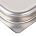 A Vollrath stainless steel square pan with a lid on top.