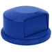 A blue round Rubbermaid trash can lid.