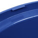 A close up of a blue Rubbermaid BRUTE trash can lid.