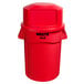 A Rubbermaid red BRUTE 44 gallon trash can with a dome top lid.