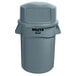 A Rubbermaid BRUTE 44 gallon gray trash can with dome top lid.