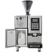 An Astra SM111 Super Mega I automatic coffee machine with a white jug of milk.