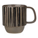 A tan stoneware coffee mug with a handle and black stripes.