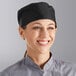 A woman wearing a black Choice mesh chef hat with a skull cap top.