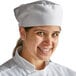A woman wearing a white Choice mesh top chef's hat.