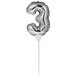 A silver balloon shaped like the number three on a white pole.