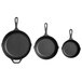 A group of three Lodge pre-seasoned cast iron skillets with handles.