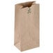 A brown paper bag with green writing that says "Duro Heavy Duty"