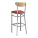 A Lancaster Table & Seating Boomerang bar stool with a burgundy vinyl seat and driftwood back.