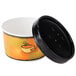 A black and orange Huhtamaki paper soup container with a black vented lid.