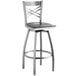 A Lancaster Table & Seating stainless steel cross back bar stool with a black wood seat.