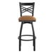 A Lancaster Table & Seating black cross back swivel bar stool with a light brown seat.