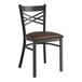 A Lancaster Table & Seating black metal cross back chair with a dark brown padded seat.