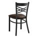 A Lancaster Table & Seating black metal cross back chair with a dark brown padded seat.
