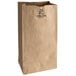 A bundle of Duro heavy duty brown paper bags with black text on them.