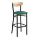 A Lancaster Table & Seating bar stool with a green vinyl seat and driftwood back.