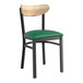 A Lancaster Table & Seating Boomerang Series black chair with green vinyl seat and driftwood back.