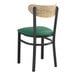 A Lancaster Table & Seating black chair with green cushion.