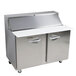 A stainless steel Traulsen refrigerated sandwich prep table with two doors and a top.