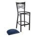 A Lancaster Table & Seating black cross back bar stool with a navy cushion.