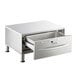 A stainless steel ServIt freestanding drawer warmer with a drawer open.