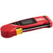 A red and black Cooper-Atkins digital thermometer with a yellow handle on a counter.