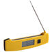 A Taylor yellow digital folding thermometer with a long needle.