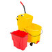 A yellow Rubbermaid WaveBrake mop bucket with a red dirty water bucket attached.