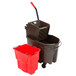 A brown Rubbermaid mop bucket with a red dirty water bucket and a mop.