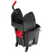 A black Rubbermaid Executive Series WaveBrake mop bucket with red dirty water bucket on wheels.