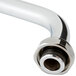 A chrome steel Equip by T&amp;S swing nozzle pipe with a metal end.