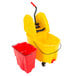 A Rubbermaid yellow mop bucket on wheels with a red wringer and dirty water bucket.