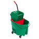 A Rubbermaid green mop bucket with a red dirty water bucket inside.