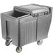 A grey plastic Cambro mobile ice bin with a sliding lid and wheels.