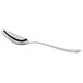 An Arcoroc stainless steel demitasse spoon with a silver handle and spoon.