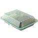 A jade green GET reusable plastic container with 2 compartments filled with brown food.