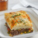 A plate with a slice of Spring Glen Fresh Foods Beef Shepherd's Pie on it.