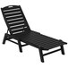 A black POLYWOOD Nautical chaise lounge chair with a wooden frame.