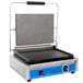 A Globe Panini Sandwich Grill with a black and blue surface and a handle.