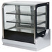 A Vollrath glass countertop display case with shelves and a glass door.
